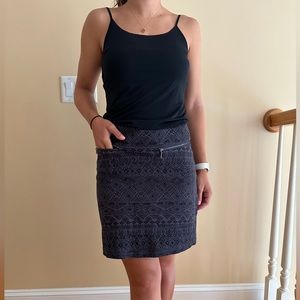 Short athletic-style skirt with geometric pattern, like new, no rips or stains